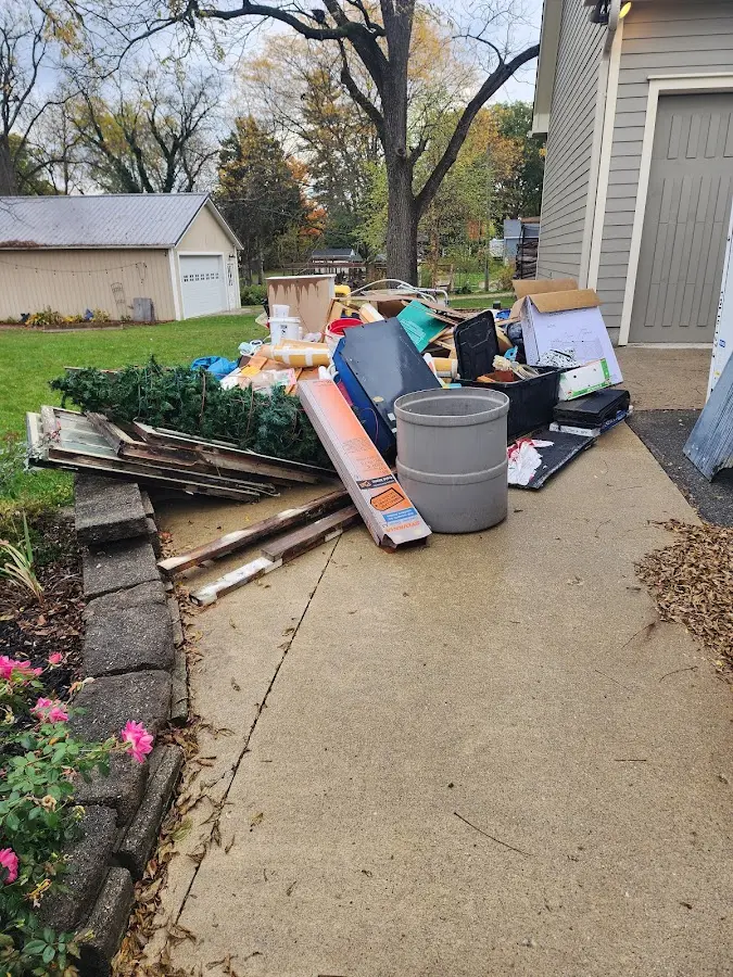 Dumpster being loaded with debris for 3 Yard Dumpster Rental in Hamtramck
